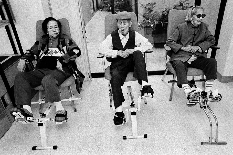 Three senior citizens on exercise bikes.