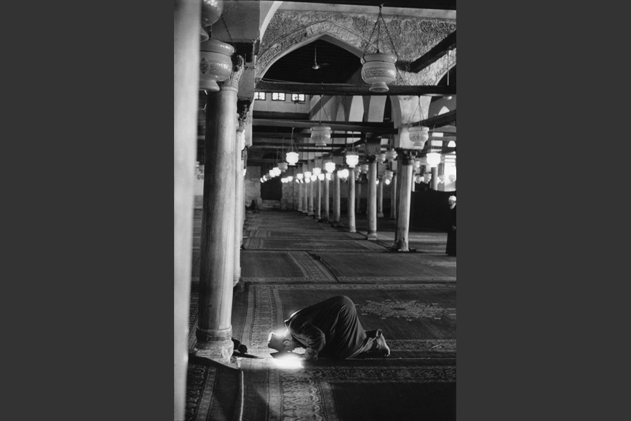 A man prays in a mosque.