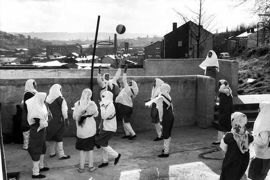 Schoolgirls playing basketball.