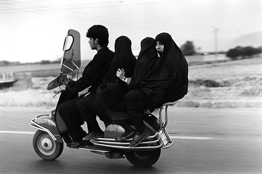 Four people on a motorcycle.