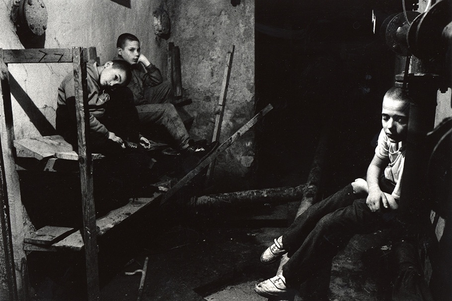 Three boys in a basement.