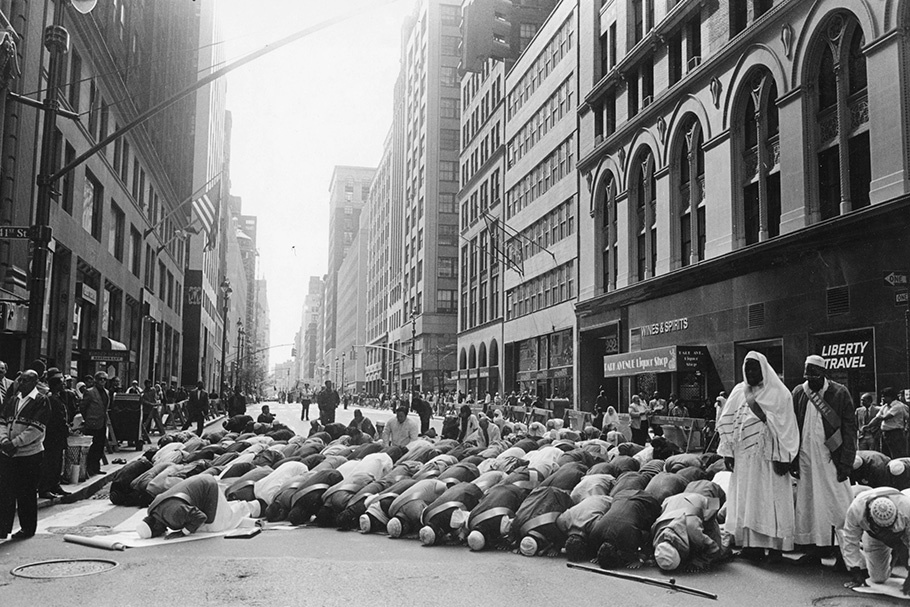 Muslim men praying in a Manhattan street.