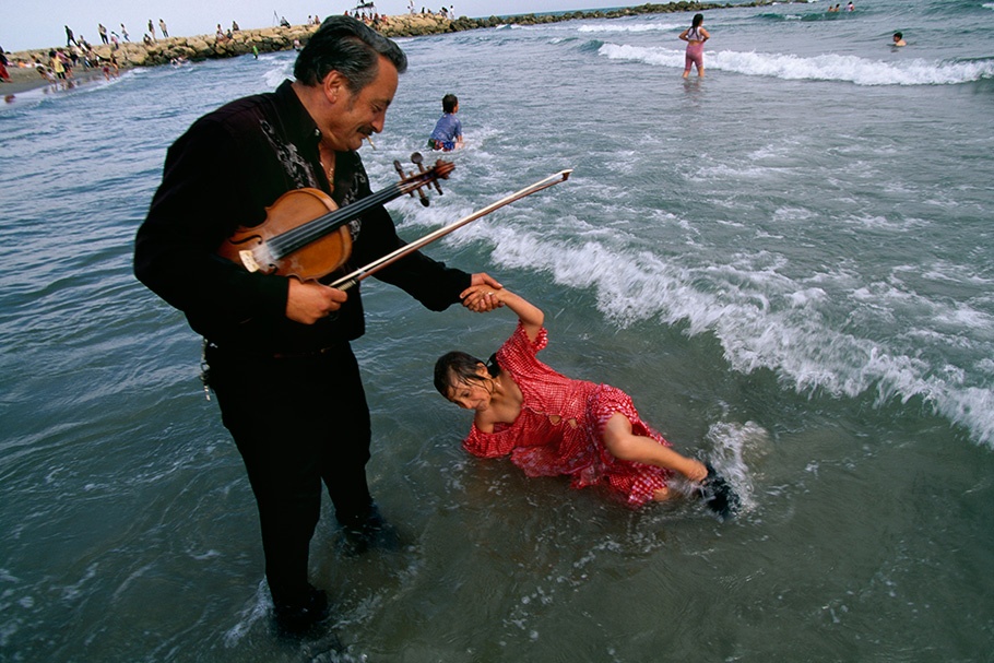 A violist and a girl in water.