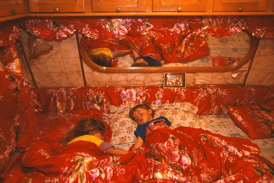 Children asleep in bed.