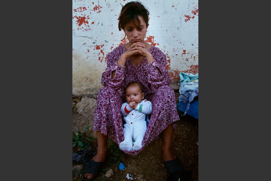 Woman with a baby on her lap.