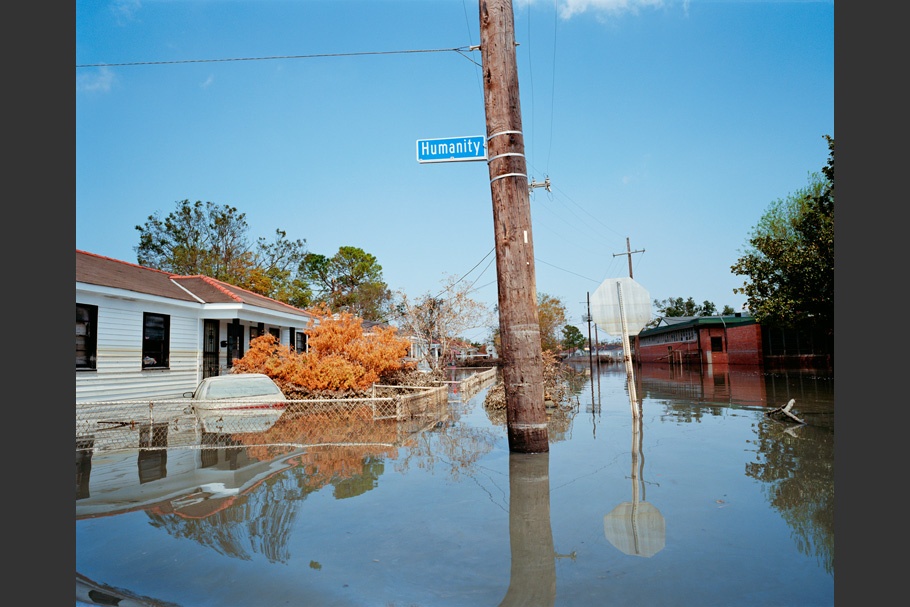 Flooded street with Humanity Street sign.
