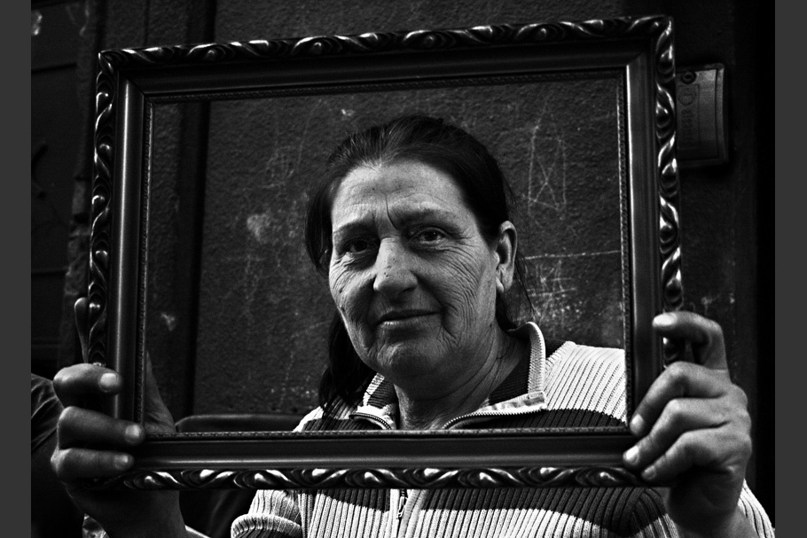 Woman viewed through picture frame.