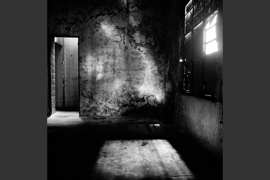 Light illuminating the interior of a former torture room