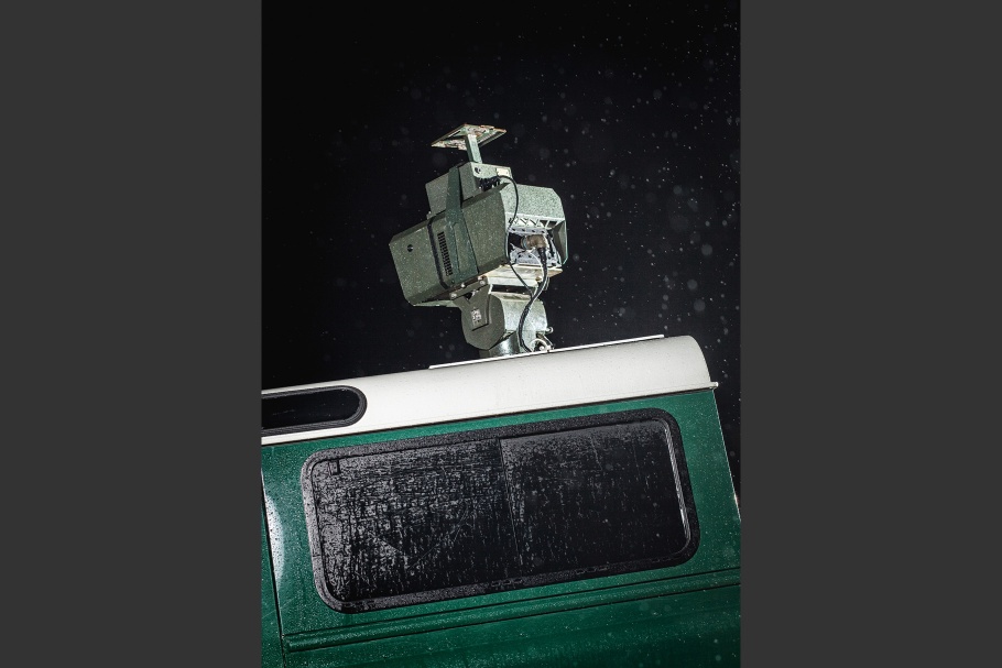 Close-up of thermal imagining camera mounted atop a green vehicle