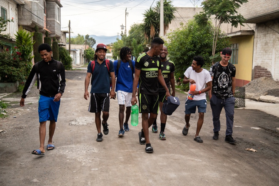 A group of men in soccer clothes walking